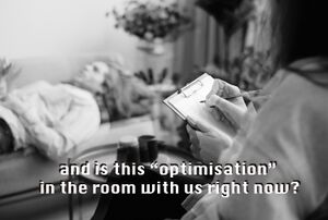A person lying on a therapist bed with the words "and is this "optimisation" in the room with us right now?" overlaid